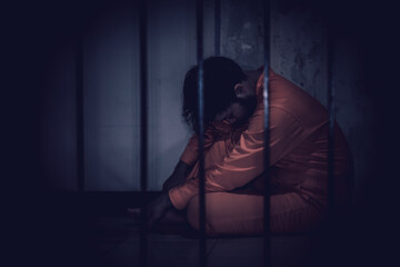 Asian man desperate at the iron prison,prisoner concept,thailand people,Hope to be free,Serious...