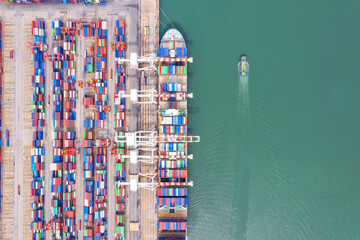 Container , container ship in export and import business and logistics. Shipping cargo to harbor by...