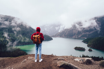 Anonymous person admiring scenery of mountain river