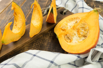 autumn background with pumpkin on wooden board