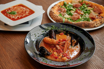 Seafood, pizza and tomato soup