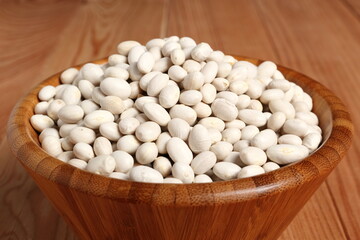 Navy beans in wooden bowl