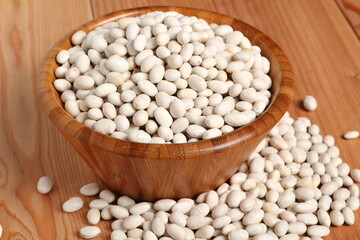 Navy beans in wooden bowl