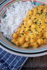 chickpeas with curry accompanied by basmati rice