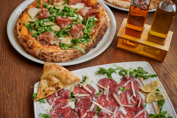 Carpaccio, pizza and olives