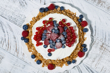 healthy oatmeal cake with yogurt and fresh berries, top view