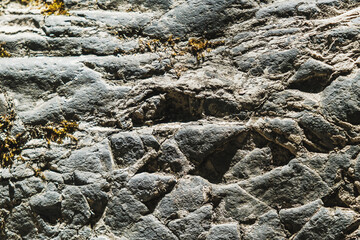 Rusty old stone texture for background and design concepts. the shadow on the rock. geology. Horizontal