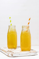homemade citrus lemonade on a white background, vertical