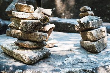 zen stone stack with balanced stones on stones in equilibrium, pile of rocks in the woods