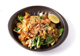 Soy sauce noodles with pork in a black plate