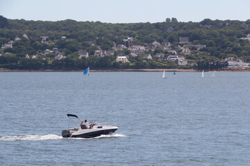 Couple sailing in a boat in Brest bay