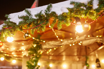 Decorated christmas tree on street with balls, toys