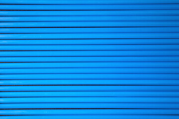 Obraz premium close-up on blue plastic drinking straws . 