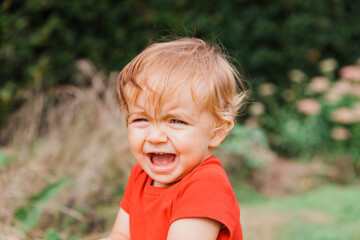 Portrait of happy baby girl outdoors