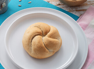 breakfast bread roll on round plate