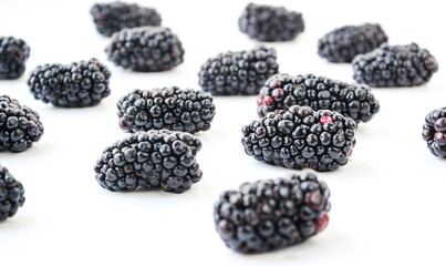 Group of ripe blackberry on a white background - 381959657
