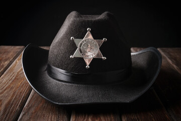 Texas police sheriff's hat in western style and revolver
