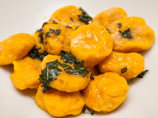 Carrot gnocchi with butter and sage