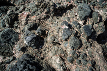 Colorful rock texture. Natural cracks void.