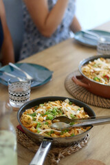 Rice noodles with coconut milk and vegetables, served on a table. Selective focus.