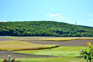 Landscape with fields and blue sky at the hillside, in upstate New York. Early fall season scene.