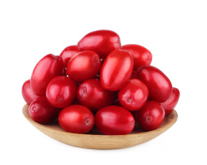 The fruits of dogwood on a wooden saucer isolated on white background