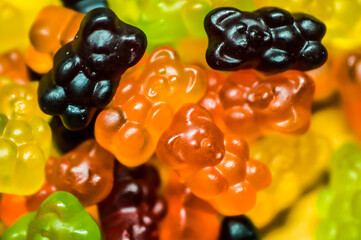 Many sweet and tasty gummy bears close-up.