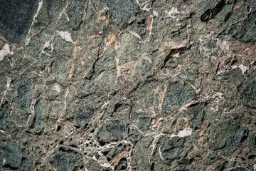 Colorful rock texture. Natural cracks void.