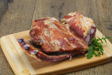 Smoked pork ribs over the wooden background