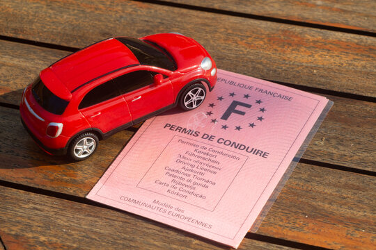 French driving license and toy car