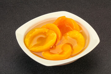 Marinated peaches fruit in the bowl