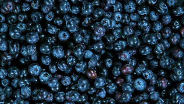 Super Slow Motion Shot of Rolling Blueberries at 1000fps.