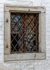 
Metal bars on the windows of old houses with an unusual pattern.