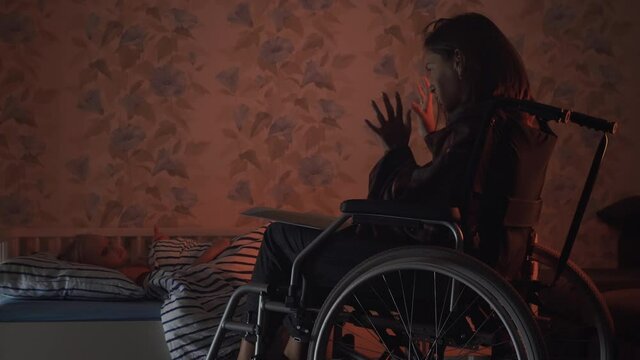 Mother in wheelchair reading to her child