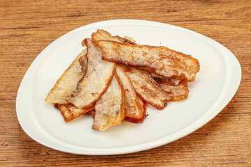 Roasted juicy bacon in the plate
