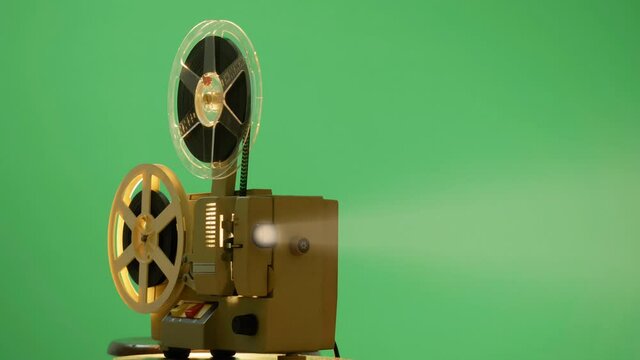 Light Beam From Vintage Film Projector On Green Screen