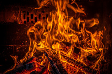 Close up view of a fire in barbecue. Use for background. Night scene.