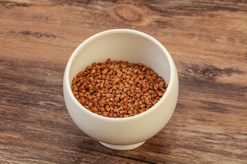 Raw buсkwheat cereal in the bowl