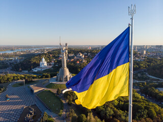 Aerial Drone Flyby Shot in Kyiv - Biggest National flag of Ukraine. Aerial view. Spivoche Pole, Kiev