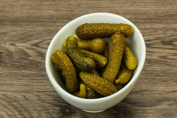 Pickled gherkin in the bowl