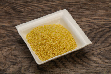 Raw cous cous heap in the bowl