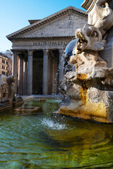 Obraz na płótnie Canvas Beautiful photo of the Pantheon, in Piazza della Rotonda with detail of the water on the renaissance fountain by Giacomo della Porta illuminated by the light of the morning sun. Rome, Italy