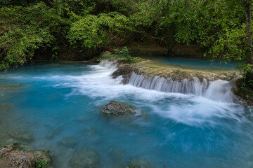 Fototapeta na wymiar small waterfalls produced elsa river in the colle di val d'elsa river park tuscany italy