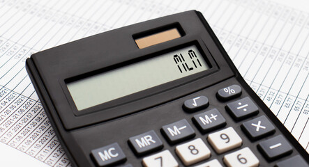 A calculator with the word MLM on the display