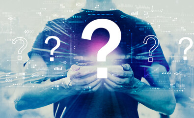 Question marks with young man using his smartphone