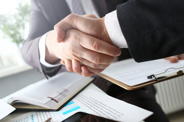 Man in suit shake hand as hello in office closeup. Friend welcome mediation offer positive introduction greet or thanks gesture summit participate approval motivation strike arm bargain concept
