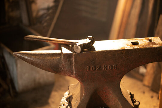 Hammer and anvil in blacksmith shop
