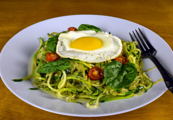 zucchini  noodles with egg spinach and tomatoes