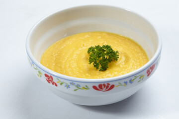 pumpkin cream soup isolated on white