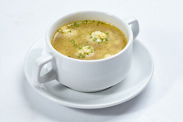soup with meatballs on the white